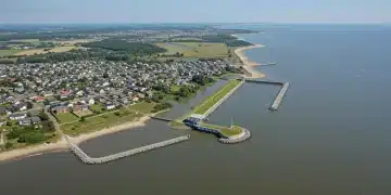 Coastal community with new flood barriers and green infrastructure for climate resilience